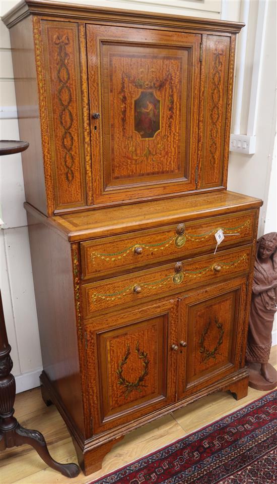 An Edwardian Sheraton revival painted satinwood side cabinet W.82cm